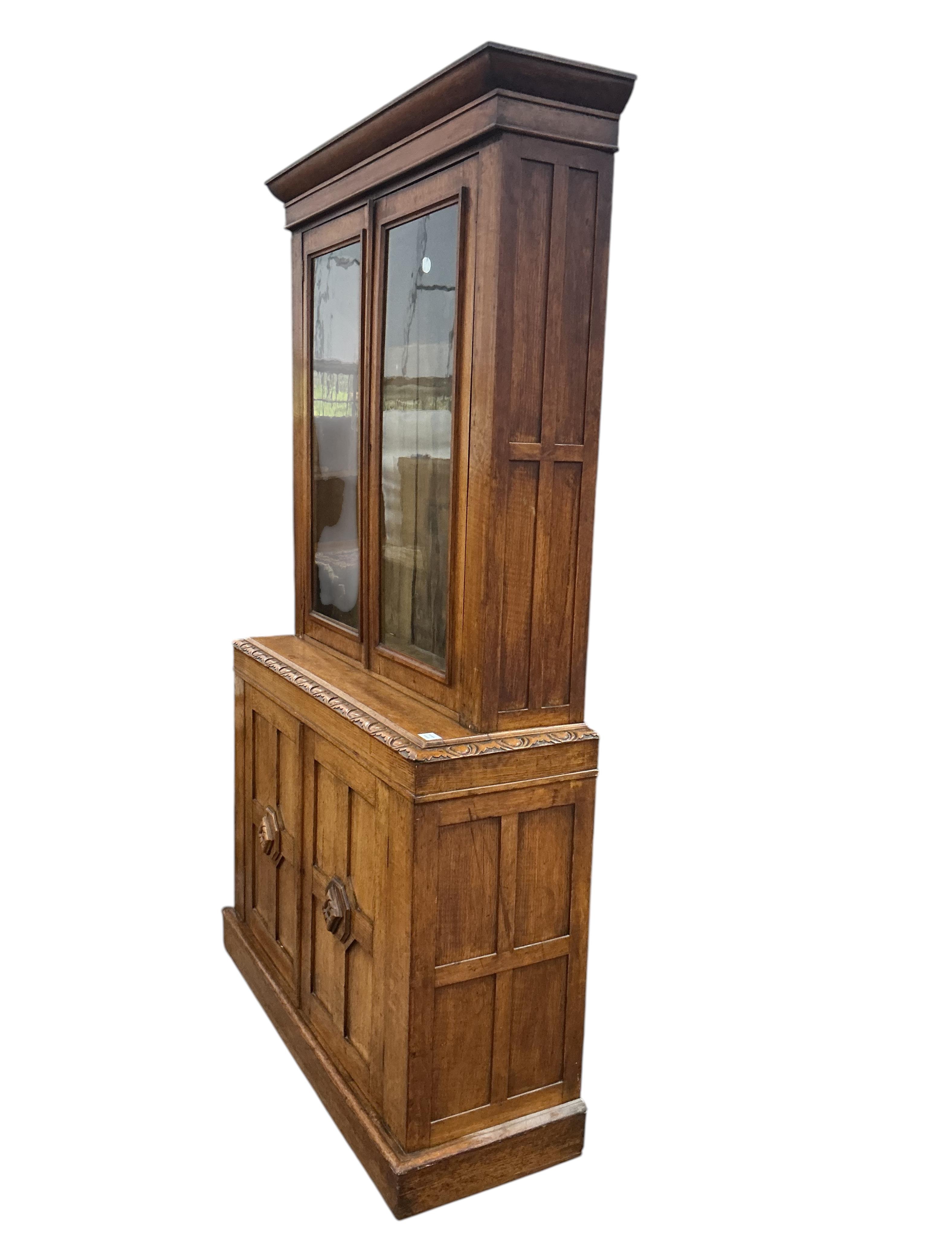 A late Victorian oak library bookcase, width 118cm, depth 40cm, height 210cm